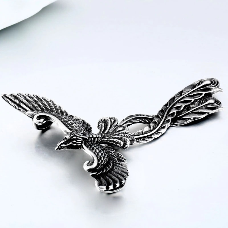 Detailed stainless steel pendant of a phoenix with open wings, perfect for retro jewelry lovers.