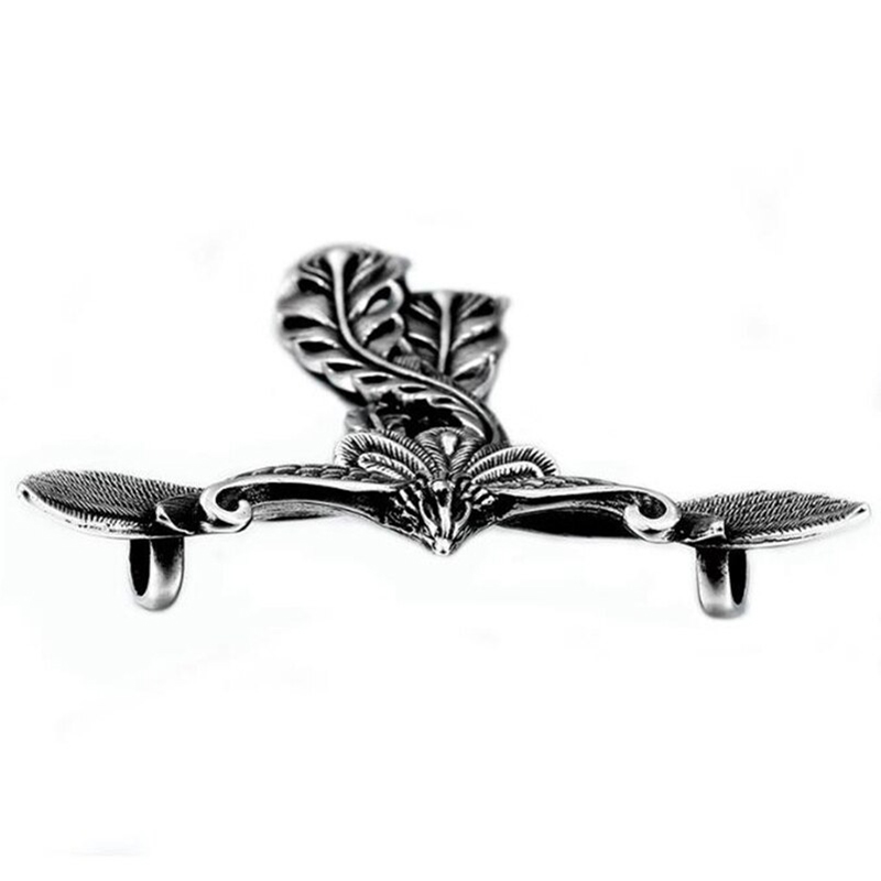 Vintage silver metal pendant featuring intricate leaf and wing design, ideal for unique retro jewelry lovers.