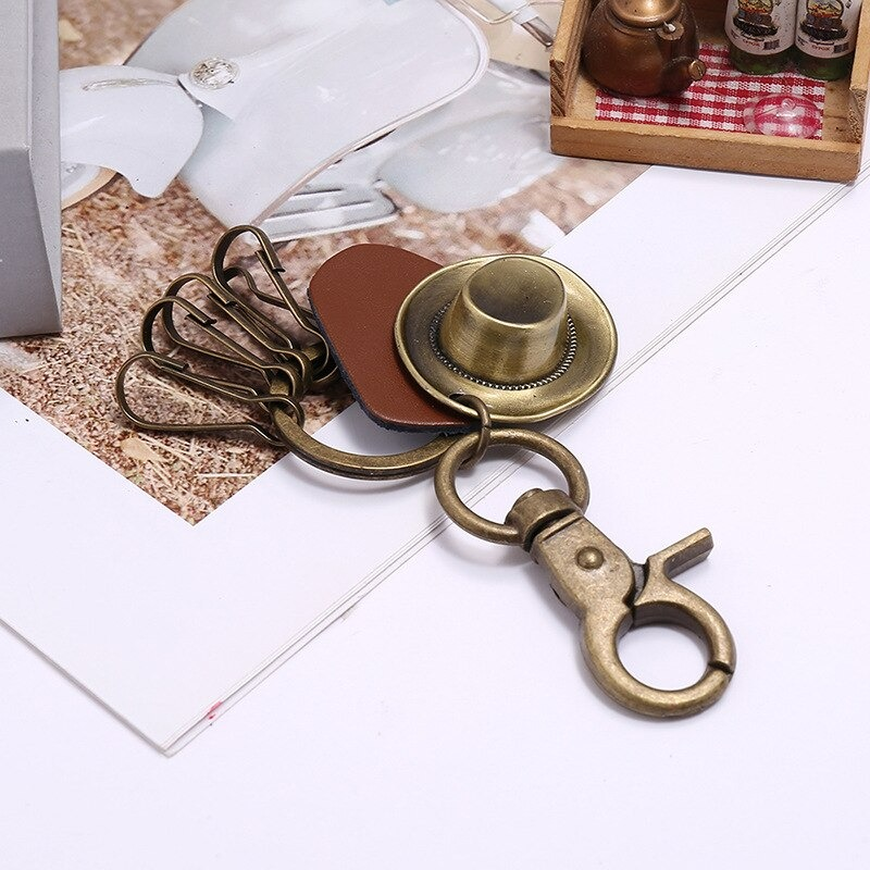 Vintage alloy hat keychain with copper finish, perfect accessory for car lovers and stylish keyring decoration.