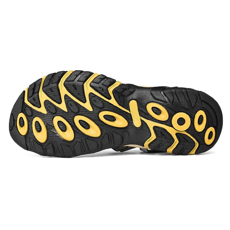 Sole of fashion anti-skid men's sandals featuring light mesh material and breathable design with strap.