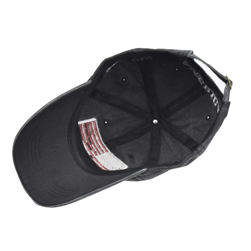 Interior view of a trendy black baseball cap with American flag detailing and a comfortable fit.