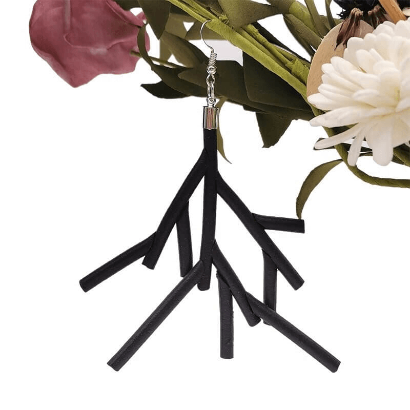 Stylish black rubber earrings featuring a unique branch design, perfect for gothic outfits and handmade accessories.