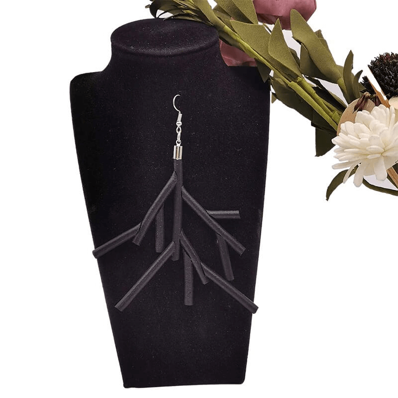 Handmade gothic black rubber earrings displayed on a stylish stand, perfect for decorating gothic outfits.
