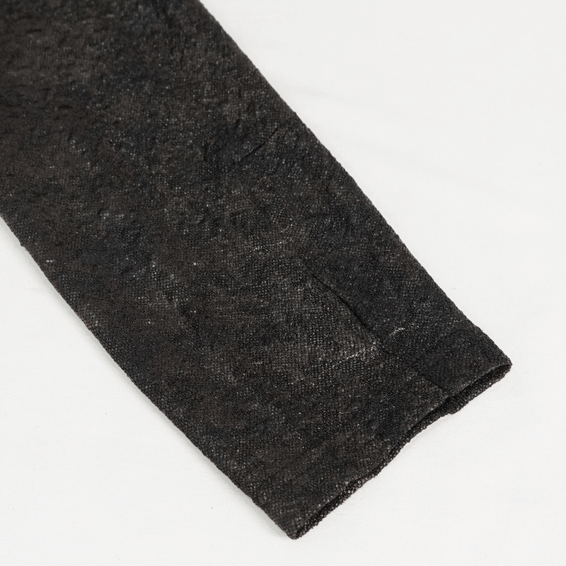 Close-up of the sleeve of a gothic black sweatshirt, featuring a textured finish and stylish cuff design.