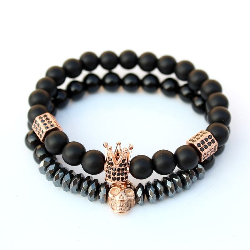 Gothic unisex fashion bracelet set featuring matte stone beads, crown, and skull charms, perfect for stylish accessories.