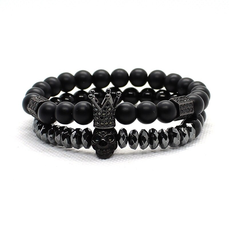 Gothic unisex fashion bracelet set with matte stone beads, crown, and skull charms.