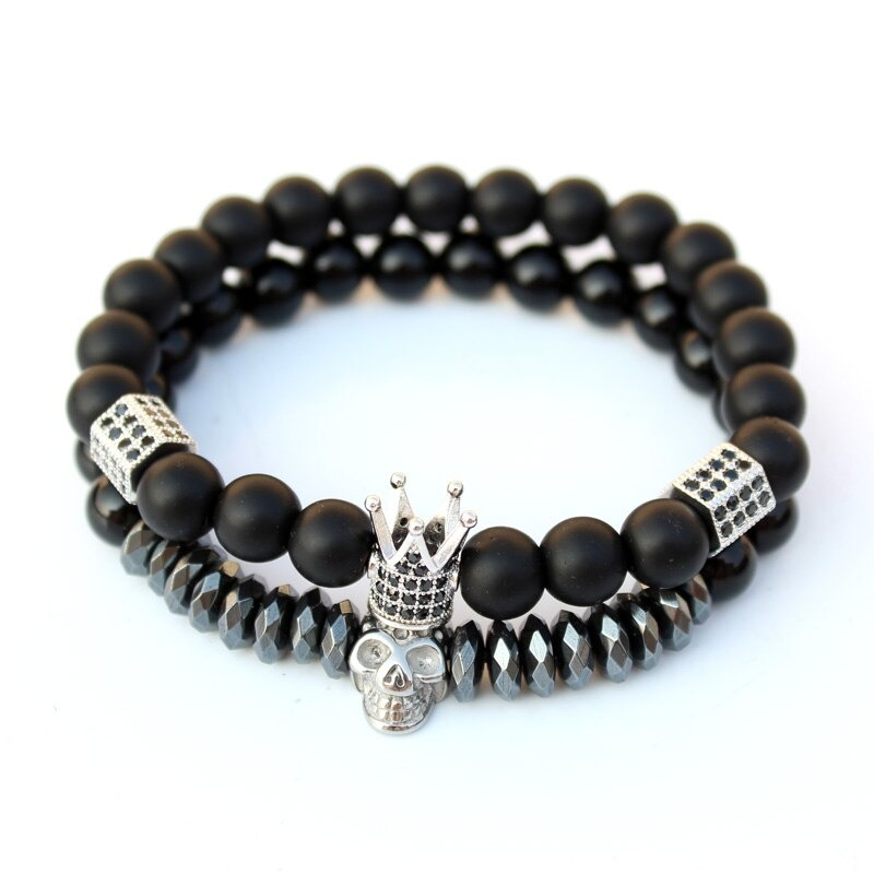 Fashion bracelet set with matte stone beads, featuring crown and skull charms, perfect for gothic unisex style.