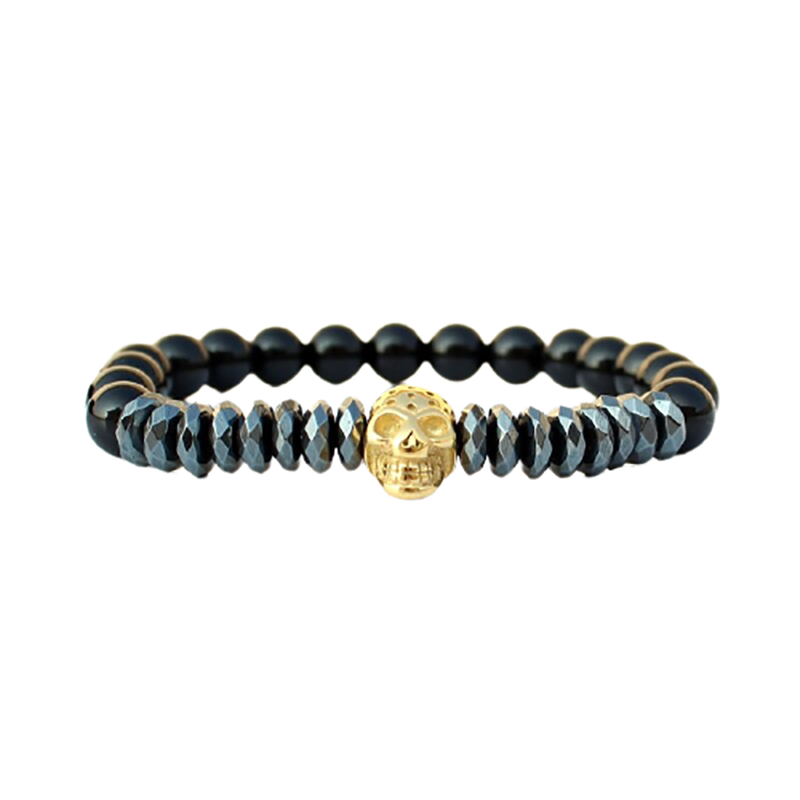 Fashion bracelet with matte stone beads and a striking gold skull charm.