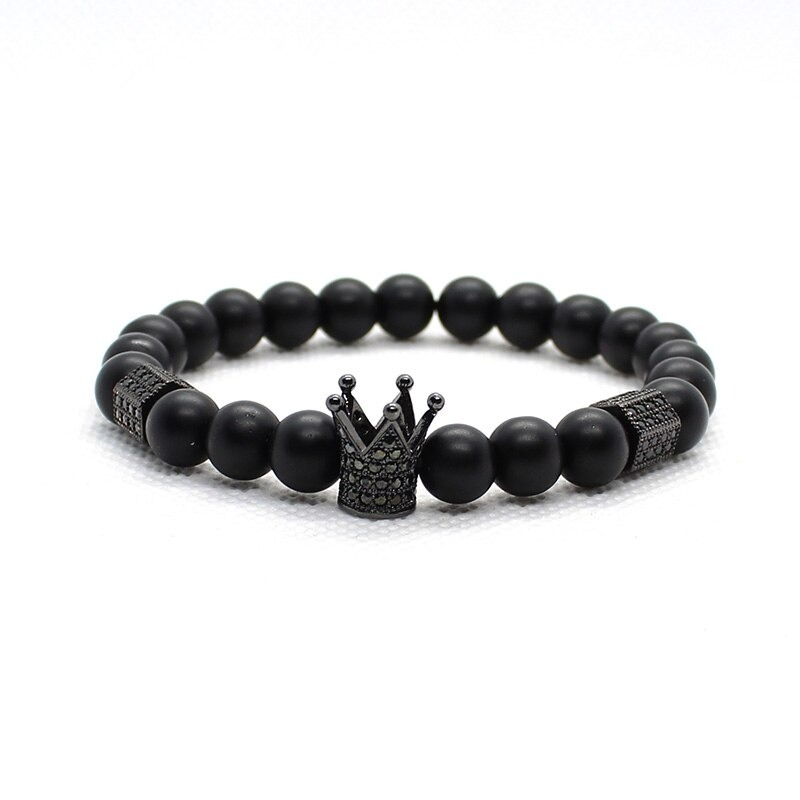 Fashion bracelet with matte stone beads featuring a crown charm, gothic unisex jewelry in black.