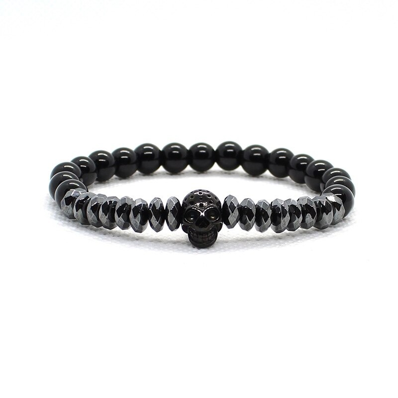 Fashion bracelet with matte stone beads, featuring a skull charm and gothic style for unisex wear.