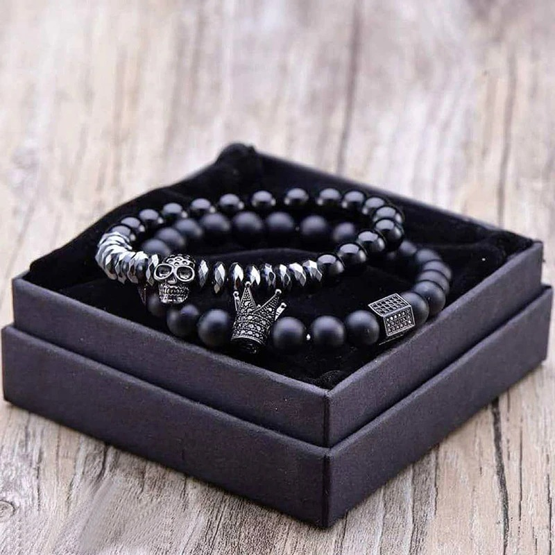 Gothic unisex fashion bracelet set with matte stone beads, skull and crown charms in a stylish black gift box.