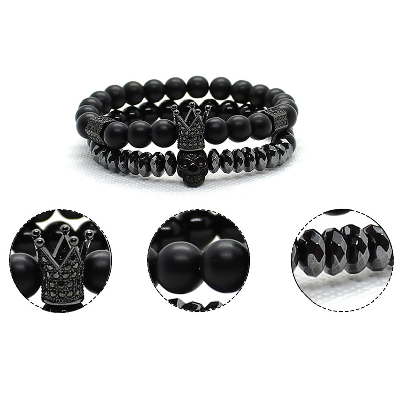 Fashion bracelet set with matte black stone beads, crown and skull charms, perfect for unisex gothic style.
