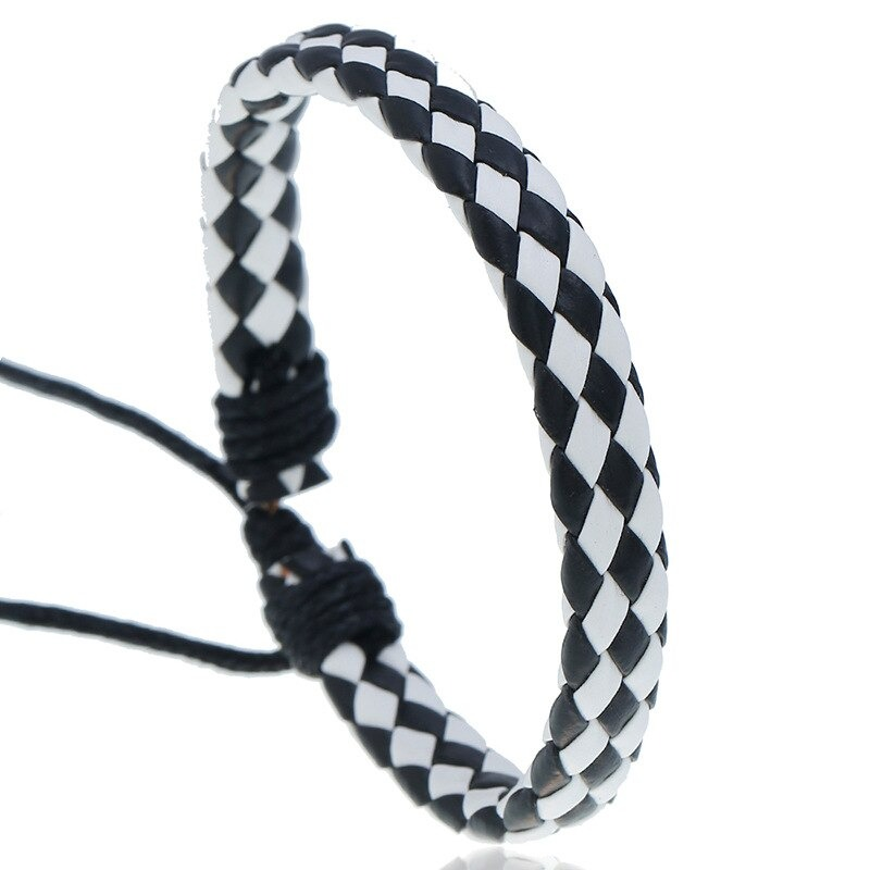 Black and white braided leather bracelet, handmade punk style accessory for unisex fashion.