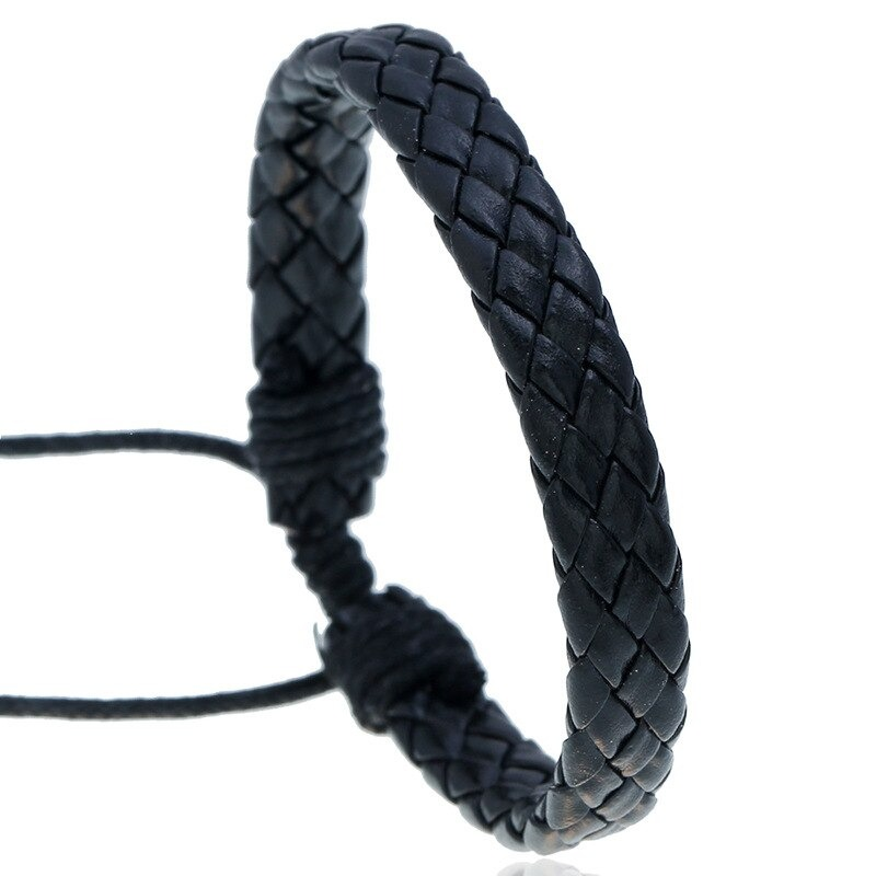 Handmade black braided leather bracelet in punk style, perfect for unisex fashion and unique accessory lovers.