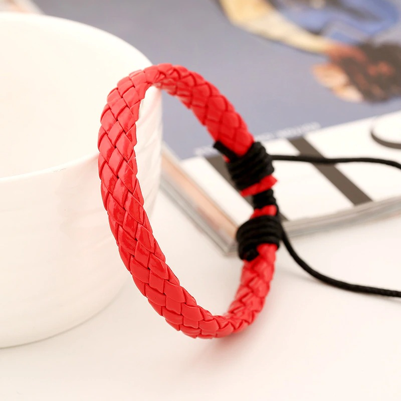 Bright red braided leather bracelet in punk style, perfect handmade accessory for unisex fashion.
