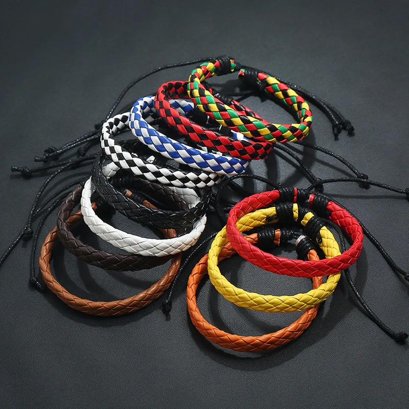 Colorful assortment of unisex handmade braided leather bracelets in punk style for stylish accessories.