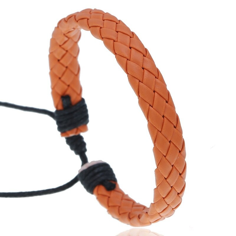 Fashion braided leather bracelet in orange, unisex handmade accessory in punk style for a trendy look.