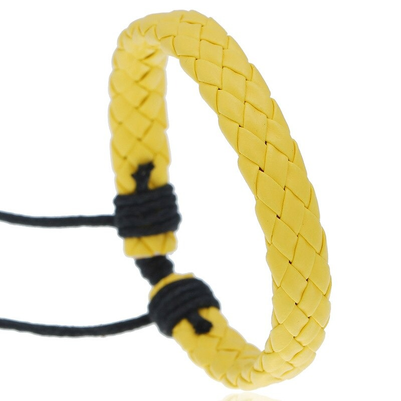 Unisex punk style braided leather bracelet in vibrant yellow, handmade accessory for bold fashion statements.
