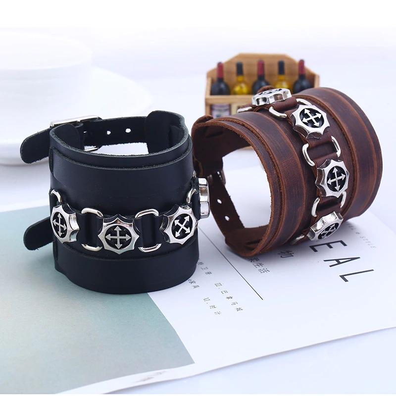 Fashion brown and black wide leather bracelets with silver pendants, perfect punk jewelry for stylish outfits.