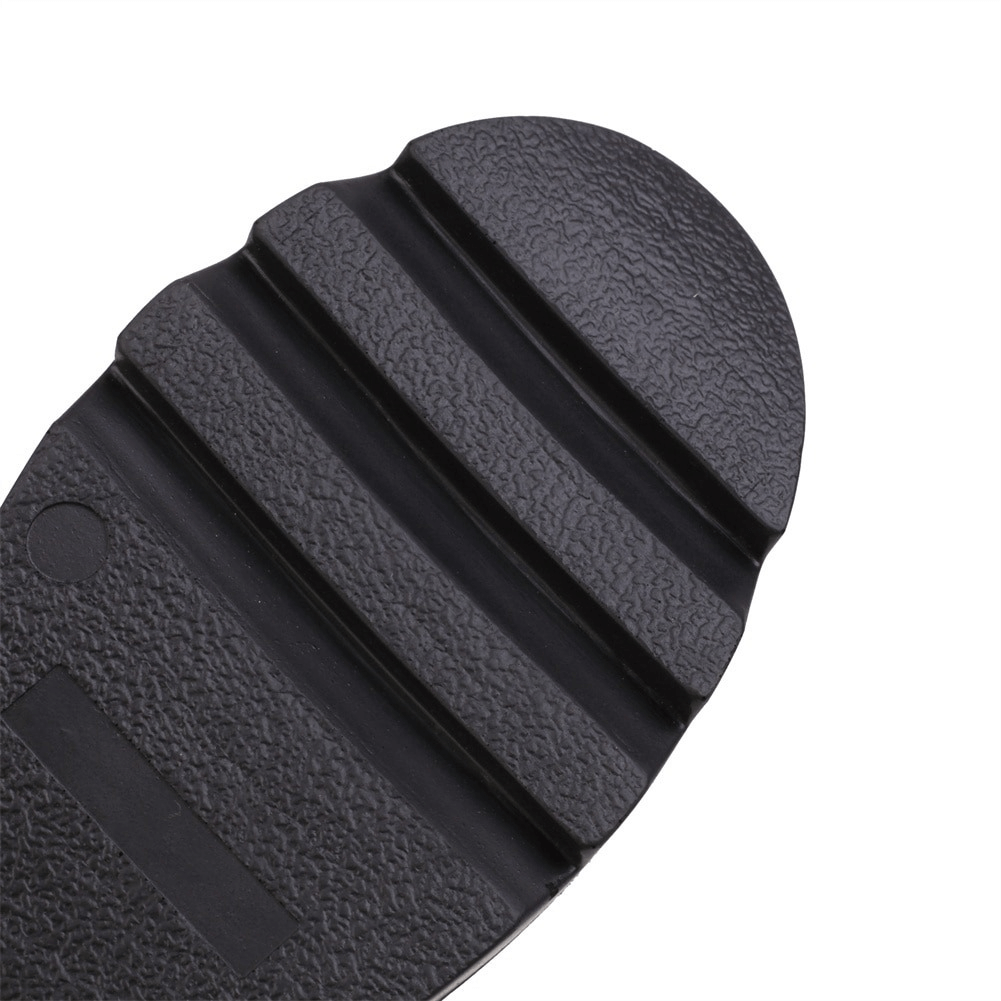 Close-up view of the textured sole of women's gothic high heels with unique pattern for enhanced grip.