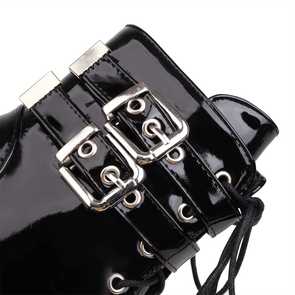 Close-up of women's gothic high heel black boots featuring stylish buckles and laces.