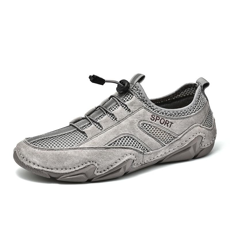 Men's casual breathable leather sneakers with mesh inserts in gray, perfect for sport and everyday wear.