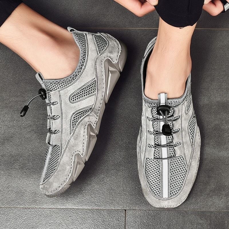 Men's stylish grey casual sneakers with mesh inserts, perfect for breathability and comfort.