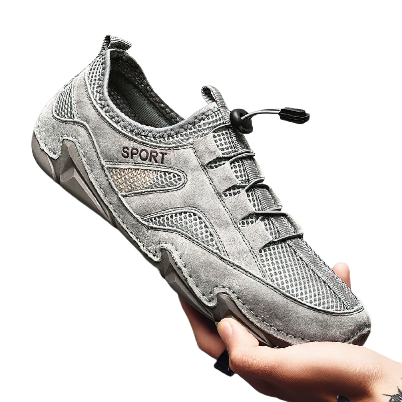Comfortable men's gray casual sneakers with mesh inserts for breathability and sporty design.