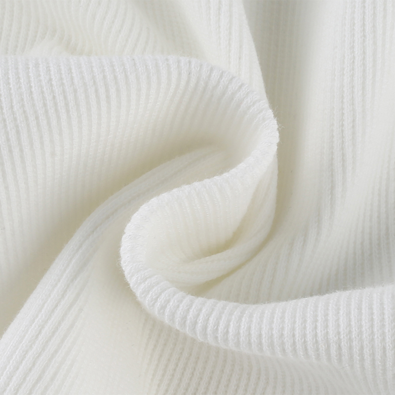 Close-up of soft white knit fabric, showcasing ribbed texture perfect for women's casual tank tops.