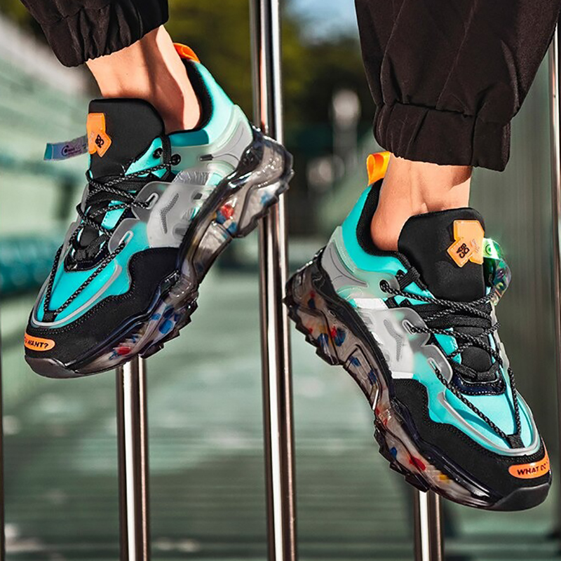Colorful chunky breathable sneakers in vibrant turquoise and black, perfect for casual sports and running.