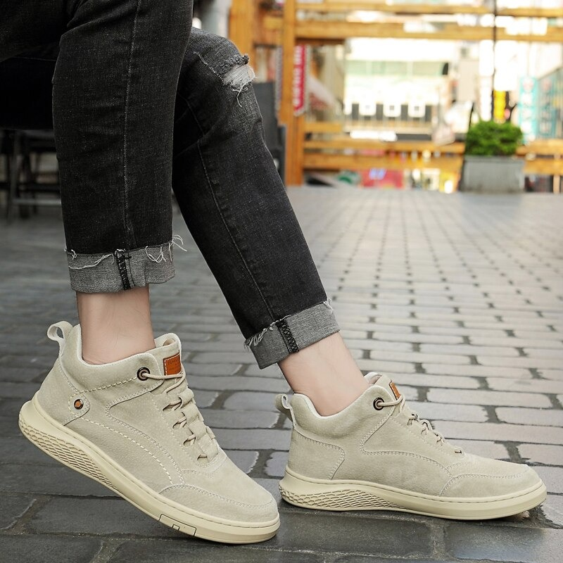 Stylish beige suede boots for men, featuring a comfortable rubber sole, perfect for casual wear.