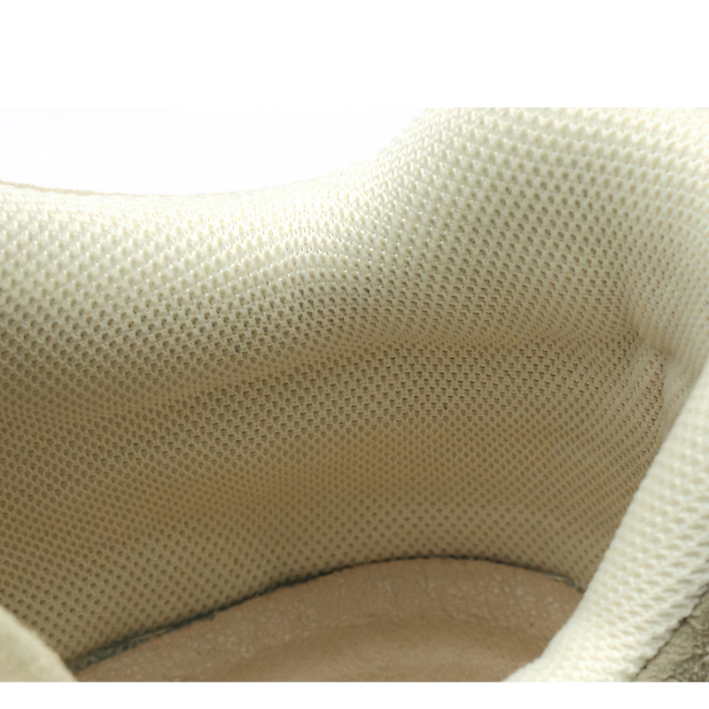 Interior view of comfortable suede boots showing breathable mesh lining for enhanced comfort.