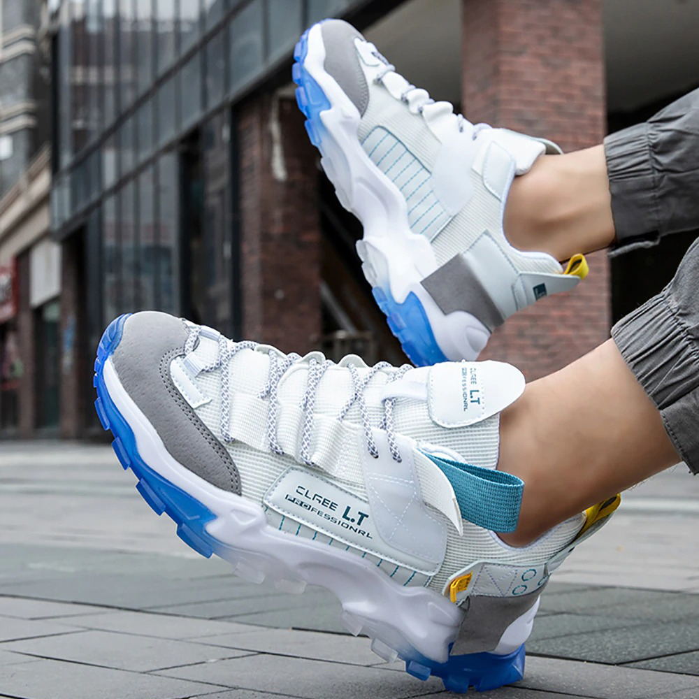 Breathable sneakers in white and gray, perfect for running and casual wear, featuring a flexible sole and stylish design.