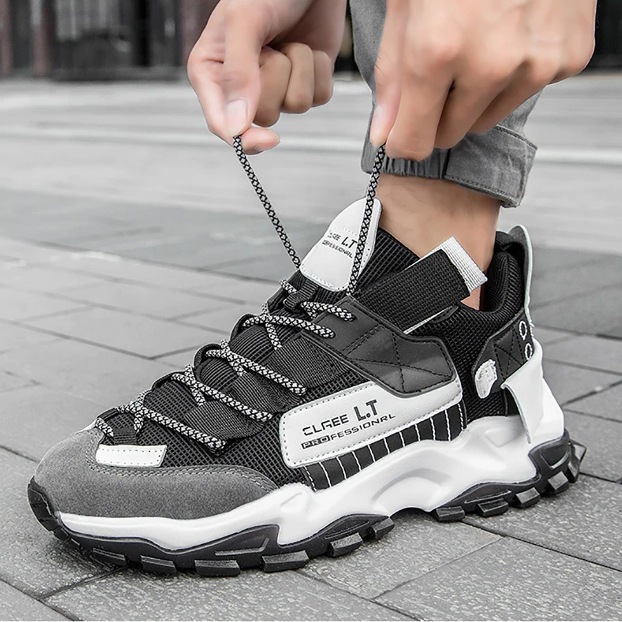 Men's breathable sneakers in black and grey, perfect for casual wear and running, featuring flexible design and stylish laces.