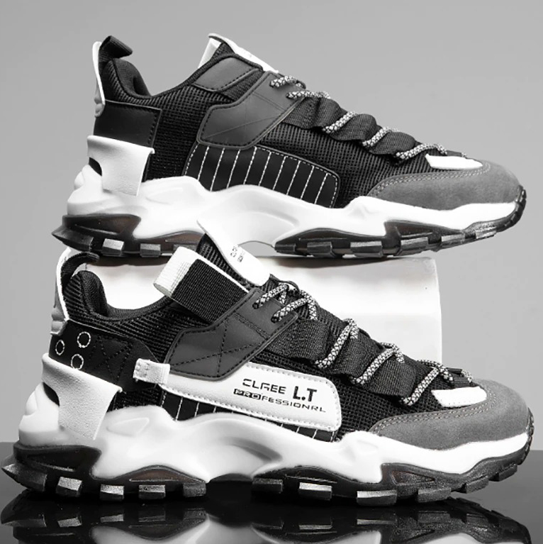 Stylish black and grey breathable sneakers, perfect for casual wear and sports, featuring a flexible sole and modern design.