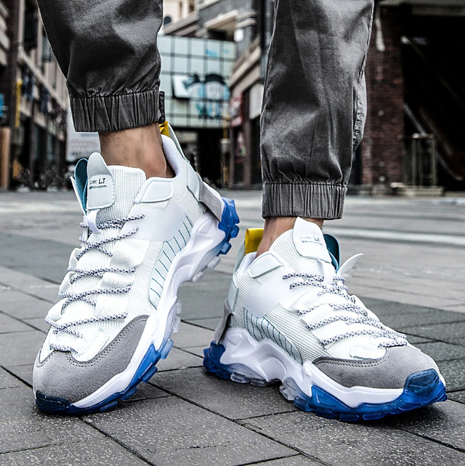 Men's breathable casual sport running sneakers in white with gray accents, perfect for everyday wear and training.