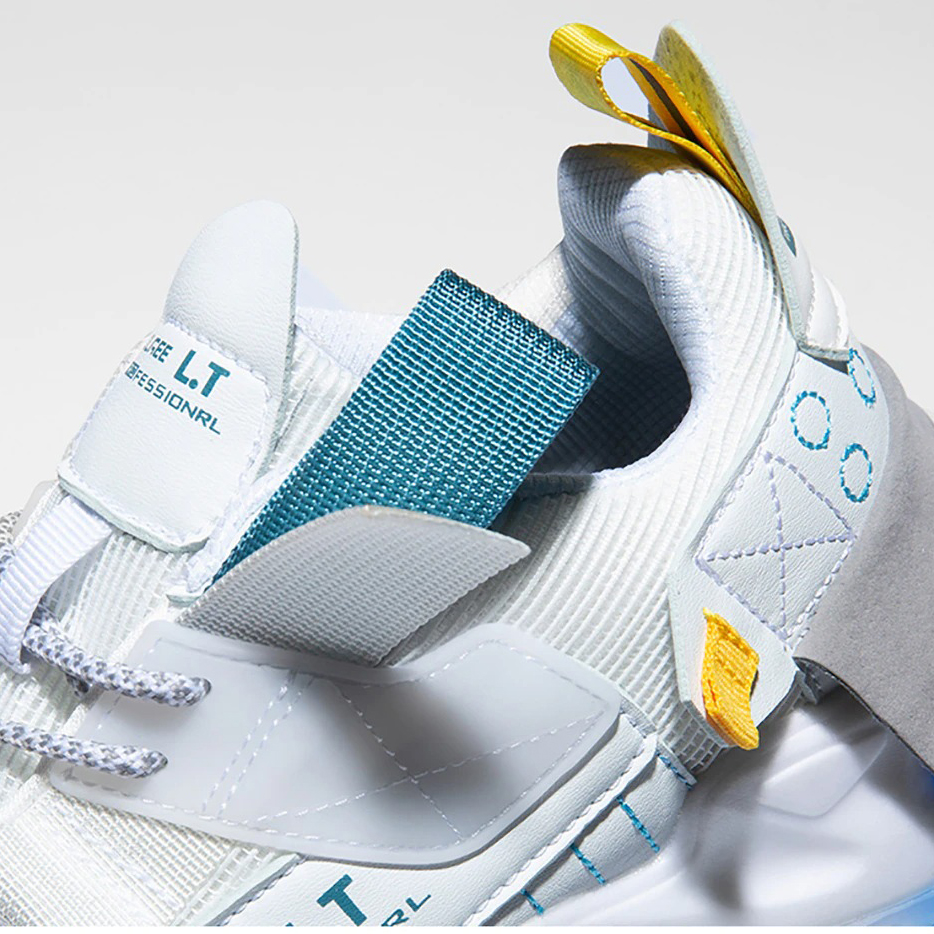 Close-up of breathable white sneakers with a flexible sole and colorful accents, perfect for casual wear and running.