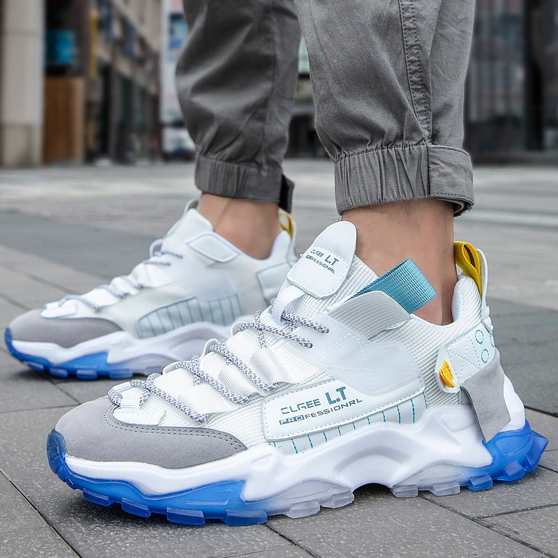 Men's breathable sneakers in stylish grey and white with blue accents, perfect for casual wear and running.