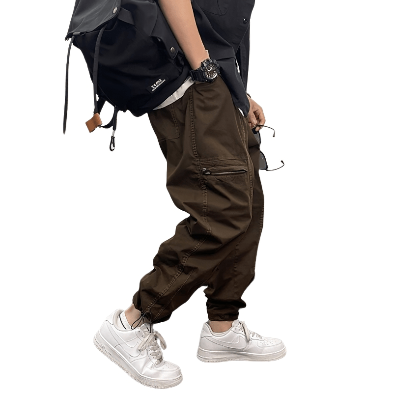 Casual drawstring harem pants styled with white sneakers and a backpack, perfect for a trendy everyday look.