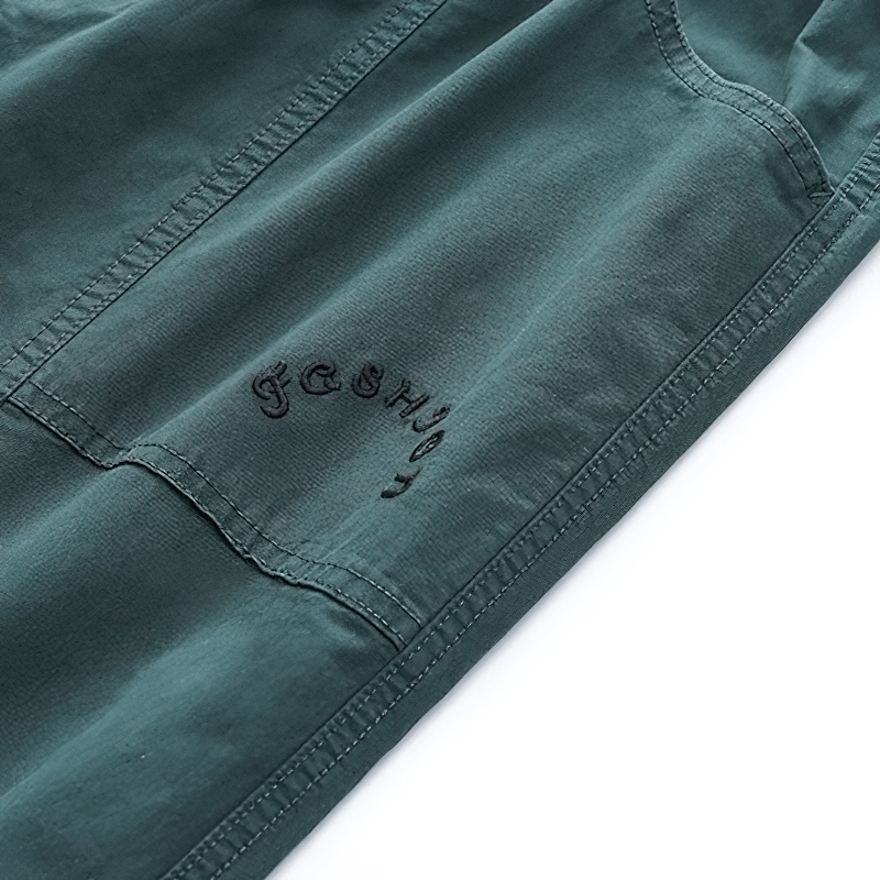 Fashion drawstring harem pants in teal with casual cargo pockets and embroidered detail.