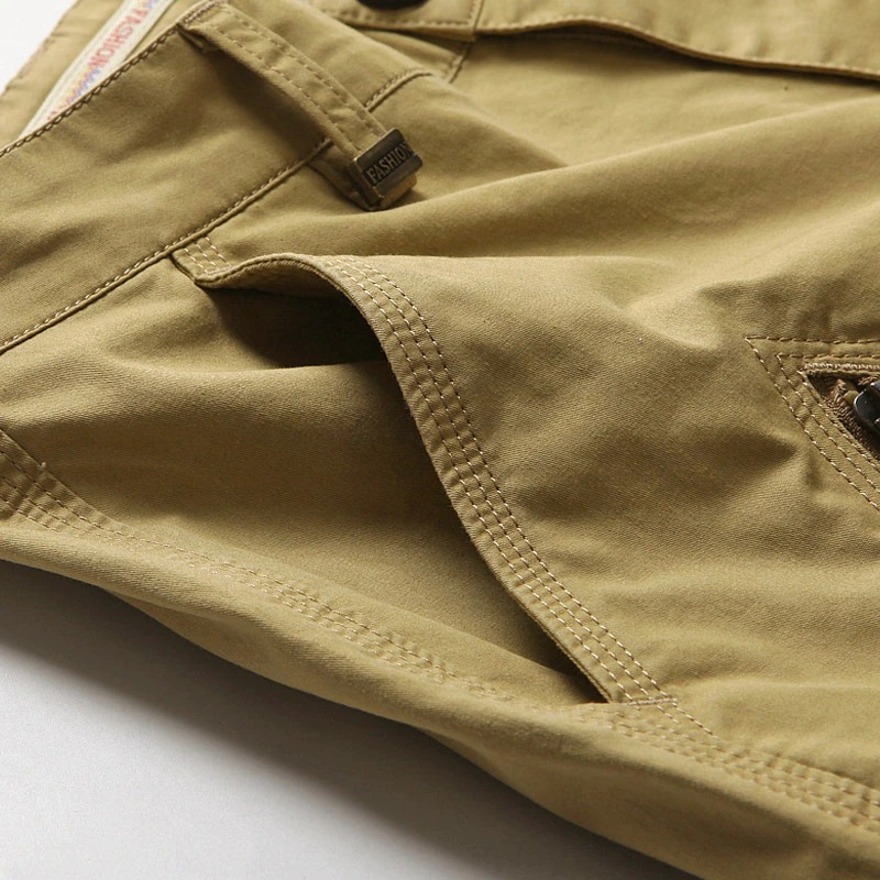 Close-up of men's cotton cargo shorts showcasing fabric texture and pocket details.
