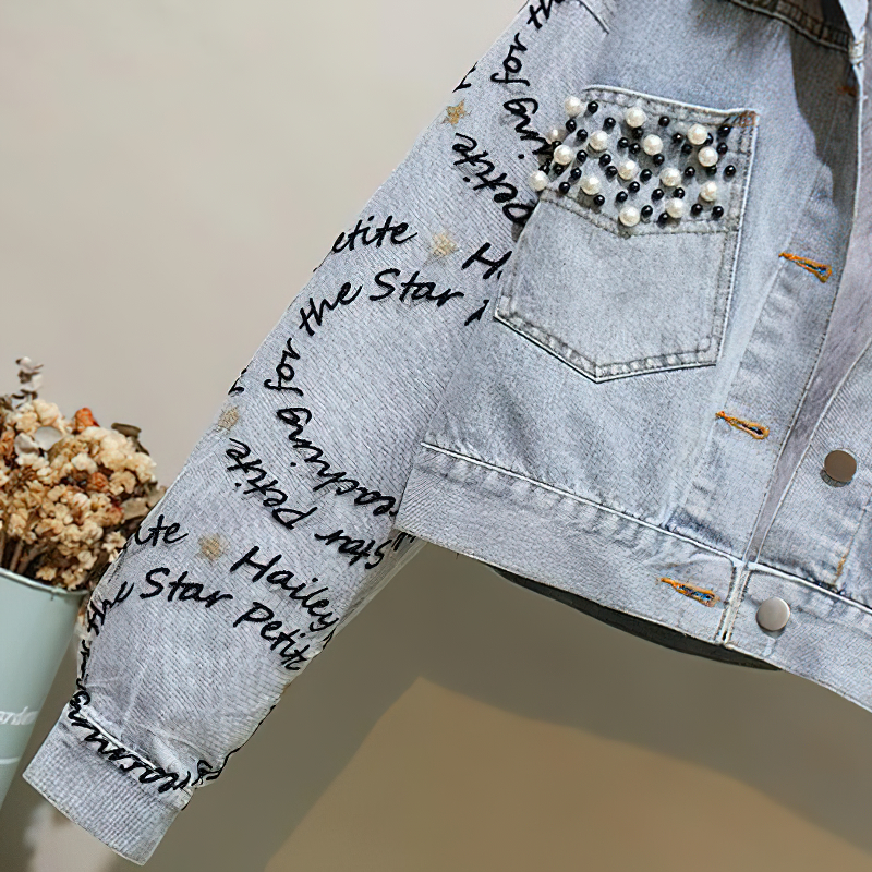 Stylish women's denim parka jacket featuring beaded embroidery, casual winter wear with unique inscriptions.