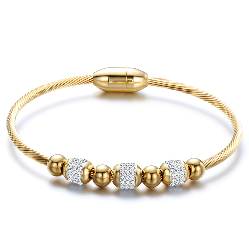 Trendy gold stainless steel bracelet with sparkling charms, perfect accessory for special moments.