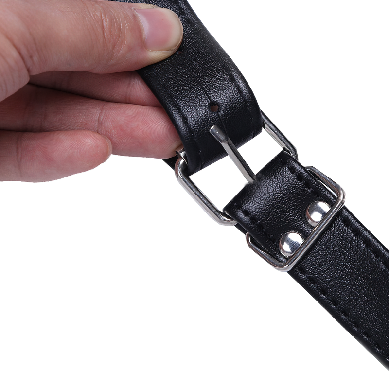 Close-up of a black faux leather cosplay chest harness buckle, showcasing details and adjustable fit for men.