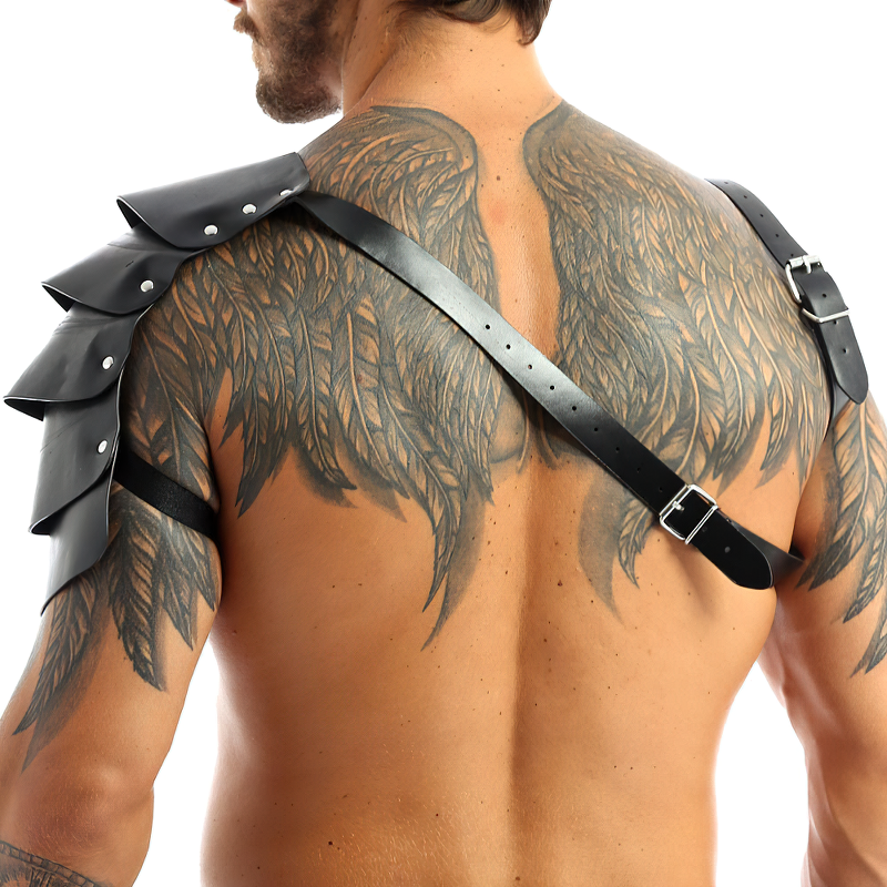 Man wearing faux leather cosplay chest harness with buckles, showcasing unique winged tattoo design.