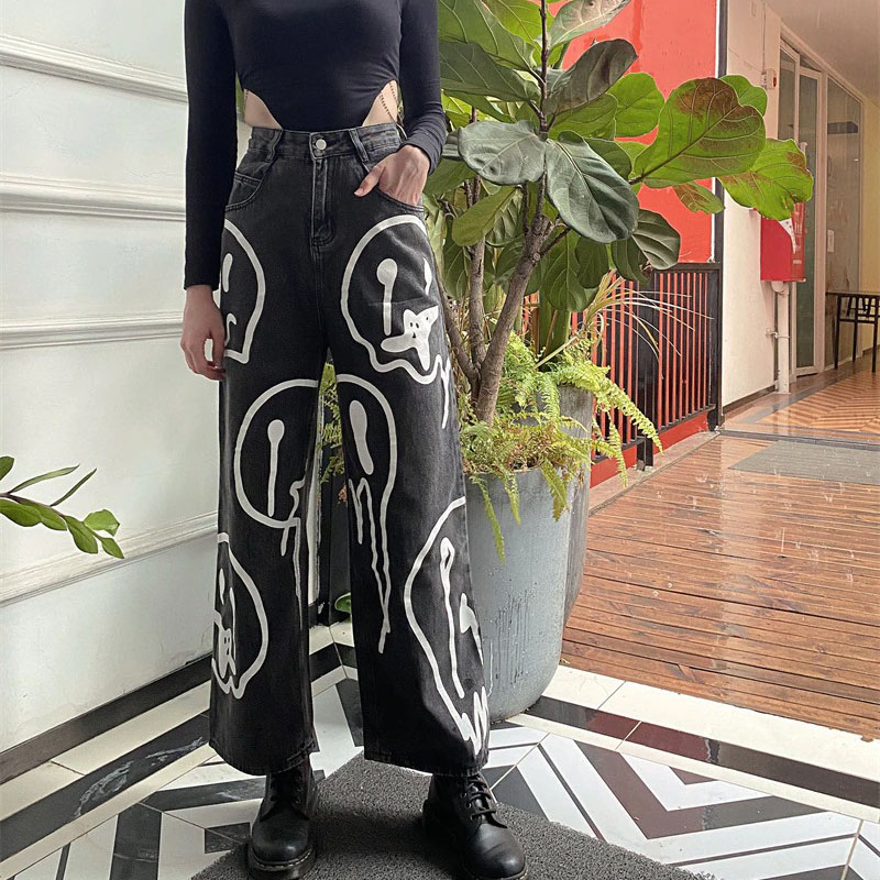 Fashionable women's black wide leg jeans with ghost print, perfect for a casual outfit. Loose fit for comfort.