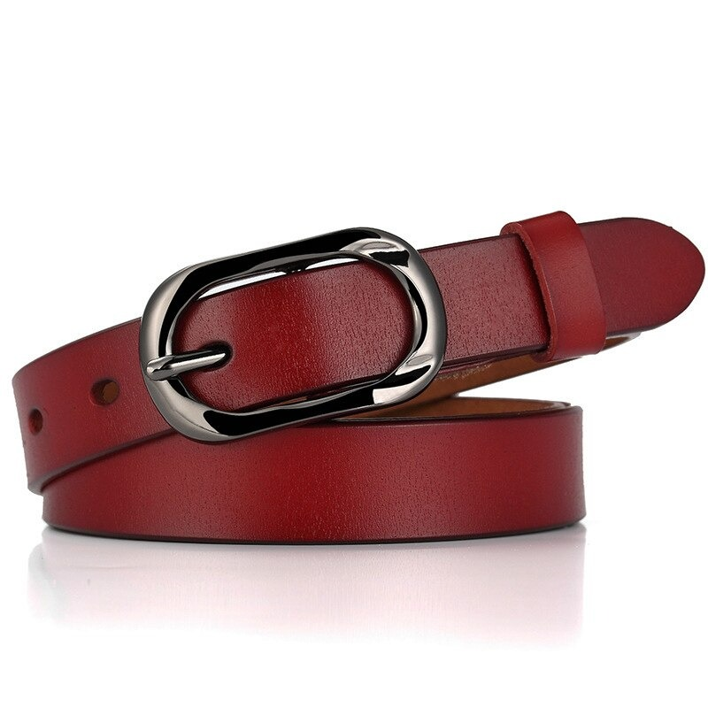 Stylish red genuine leather belt with silver pin buckle for women; perfect casual accessory for jeans.