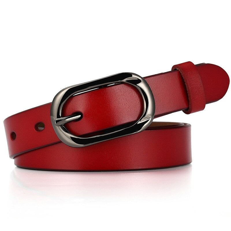 Fashionable red women's leather belt with a stylish silver pin buckle, perfect for casual jeans outfits.