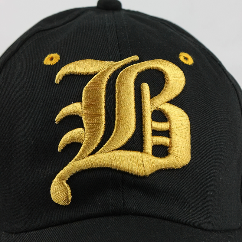 Stylish black baseball cap featuring bold golden letter B print, perfect unisex casual accessory.