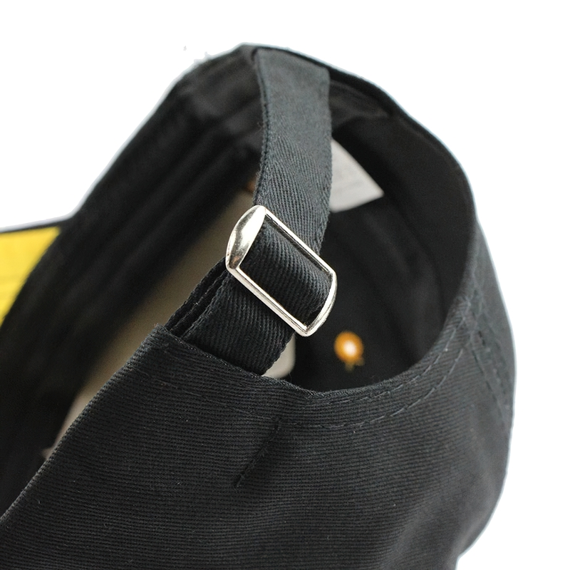 Detail view of the adjustable strap and buckle on a stylish unisex baseball cap in black.
